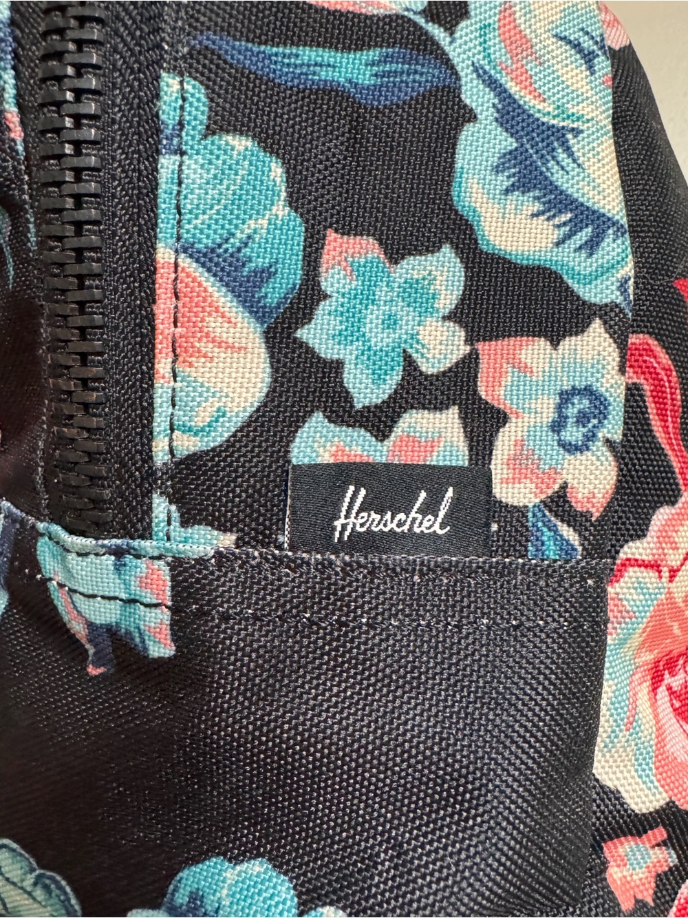 Herschel Black Floral Backpack with Teal & Coral Accents